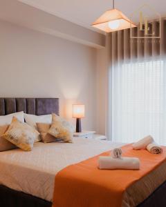 a bedroom with a bed with two towels on it at Casa da Amorosa com Vista Mar by Lethes Legacy in Abelheira