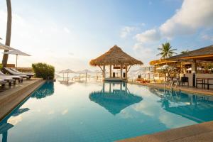 a swimming pool with a gazebo and a resort at The Beachfront Hostel in Chaweng