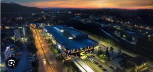 an overhead view of a city at night at Bingo CC Tuzla in Železnička Stanica Tuzla