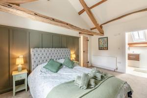 a bedroom with a large bed in a room at 2 Bed in Caldbeck oc-b38644 in Caldbeck