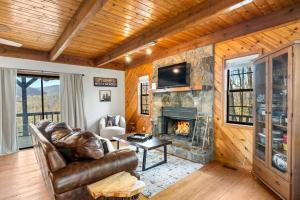 a living room with a couch and a fireplace at Making Memories in Blairsville