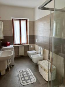 a bathroom with a toilet and a sink and a shower at Casa Olinda in Lazise +34 photos