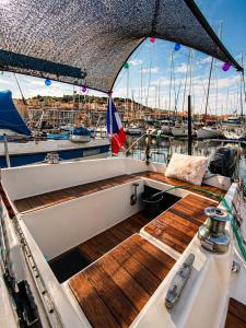 a deck of a boat in a marina at Nuit Insolite à bord d'un Voilier Sète Vieux Port in Sète
