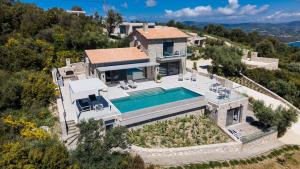 an aerial view of a house with a swimming pool at Grey Sea View Estate - Luxury Villas with Private Pool & Plunge Pool in Katouna