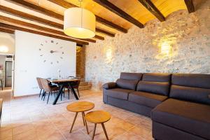 a living room with a couch and a table at Villa Sa Costa - Families or Couples Only in Calvià
