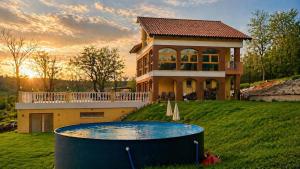 a house with a swimming pool in front of it at VILLA BEELVITA - PRIVATE POOL& JACUZZi in Bielovce