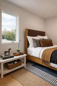 a bedroom with a bed and a window at Azur East, Southampton in Southampton