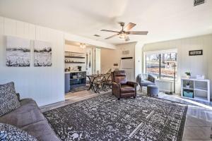 a living room with a couch and a table at Hot Tub, Pool, Dock: 2 Cabins Lakeview Grand Lake in Grove