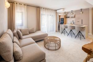 a living room with a couch and a table at CASA LEONE - fully renovated since April 2026 - new pictures in Carvoeiro
