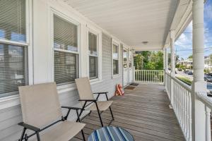 two chairs on the porch of a house at 152 Quite & Bright & Spacious Apt in Brighton in Boston
