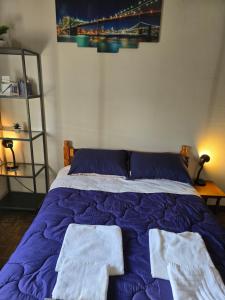 a bedroom with a bed with two towels on it at Elias Apartment in Kissonerga