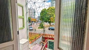 a view of a city street from a balcony at Recanto Paraense in Belém