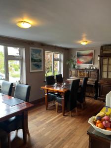 a dining room with a table and chairs at Doireliath in Bantry