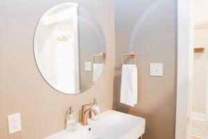 a bathroom with a sink and a mirror at Hotel Whiskey in Long Beach in Long Beach