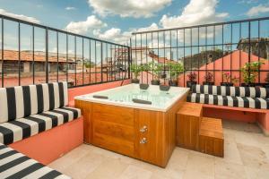 a hot tub sitting on top of a building at Casa AcoModo at Casco Viejo 6BR Mansion w Pool in Panama City