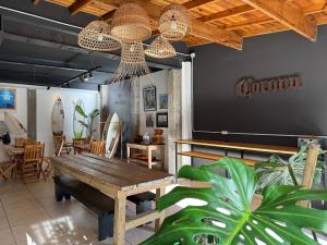 a dining room with a table and a large screen at Las Golondrinas Mar del Plata in Mar del Plata