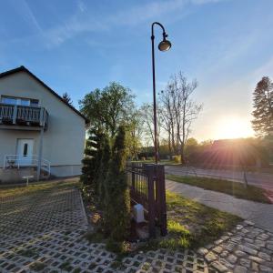 a park bench next to a street light at Carl-Schmäcke-Straße 7 in Neuenhagen