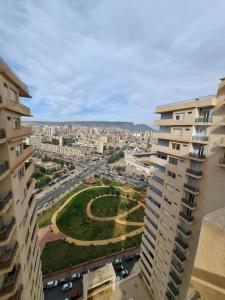 an aerial view of a city with buildings and cars at Tulipe appartement in Oran +10 photos