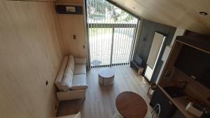 an overhead view of a living room in a tiny house at Chalet Villerest in Villerest