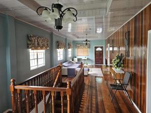 a living room with a staircase and a couch at Your East Coast Get Away - 43 DougVille in Non-Pariel
