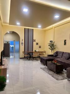 a large living room with a couch and a table at Cozy Clover house in Hat Yai