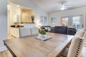 a dining room and kitchen with a table and chairs at Pool Access! Recently Updated Coastal Retreat in Foley