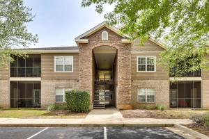 a brick house with an arched entry way at Pool Access! Recently Updated Coastal Retreat in Foley