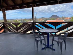 a table and chairs on a balcony with a view at Via Monica in Santa Cruz