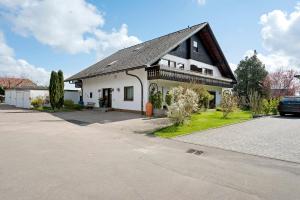 a house with a car parked in front of it at Gästehaus Brigitte in Freudenstadt