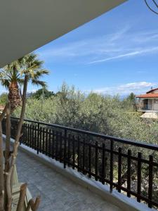 a balcony with a view of the ocean at Sea&Nature apartment in Aigio