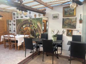 a restaurant with a table and chairs in a room at Villa EDEN BLICK in Edenkoben