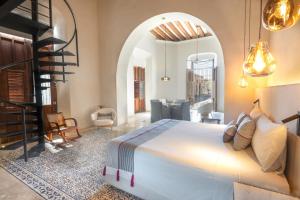 a bedroom with a large white bed in a room at Las Lupitas Hotel Boutique in Campeche +88 photos