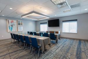 a conference room with a long table and chairs at Holiday Inn Express & Suites Logan by IHG in Logan +39 photos