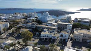 an aerial view of a city with white buildings at Villa Roussa City Center in Fira