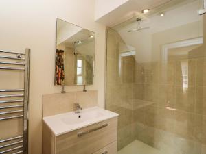 a bathroom with a sink and a shower at Ormiston House in Pewsey +40 photos