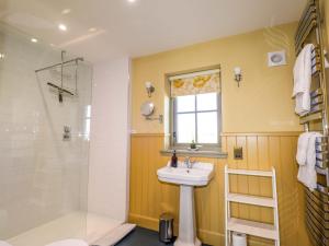 a bathroom with a sink and a shower at The Mandrel in Tain +36 photos