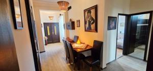 a room with a desk and a room with a hallway at Artist Apartment in Keszthely