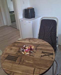a table with a plate of food on top of it at Ferienwohnung Egbert in Weißwasser +2 photos