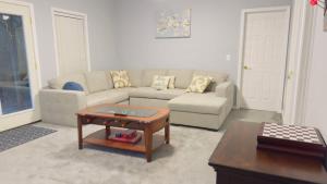 a living room with a couch and a coffee table at Dalby Way in Austell