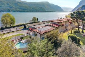 an aerial view of a house next to a lake at Villa Orchidea in Onno