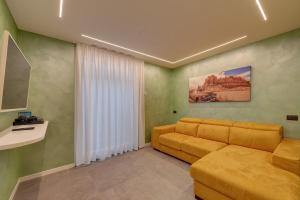 a living room with a couch and a table at Villa Orchidea in Onno