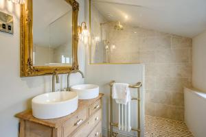 a bathroom with two sinks and a mirror at 1 Bed in Holt oc-p34797 in Holt +3 photos