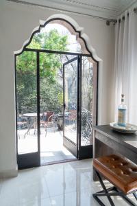 a room with an open door to a patio at Casa Amari in Mexico City +36 photos