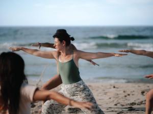 a group of women dancing on the beach at Palmar Beach Lodge in Bocas Town