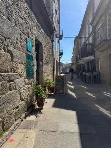 an empty street in an old stone building at Cabalo Holiday Inn in Tui