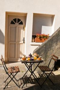 a table with food on it in front of a door at Studio cosy & bien équipé in Brétigny-sur-Orge