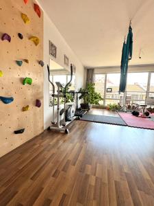 a room with a climbing wall and a gym at Sunny Gym Studio Apartment in Burgas