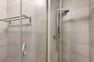 a shower with a glass door in a bathroom at Chez Guillaume in Bordeaux +29 photos