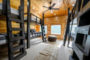 a room with four bunk beds in a cabin at Heated Pool, 7 Bedroom Cabin, 6,000 Square Feet, Arcade! in Broken Bow +212 photos
