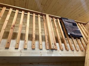 a wooden staircase in a room with a wooden ceiling at Catch'em AK - Trout Haven in Soldotna +7 photos